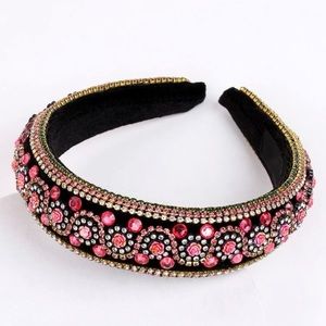 Bran new black & pink headband with jewels and stones.